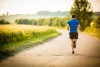 person jogging down country lane